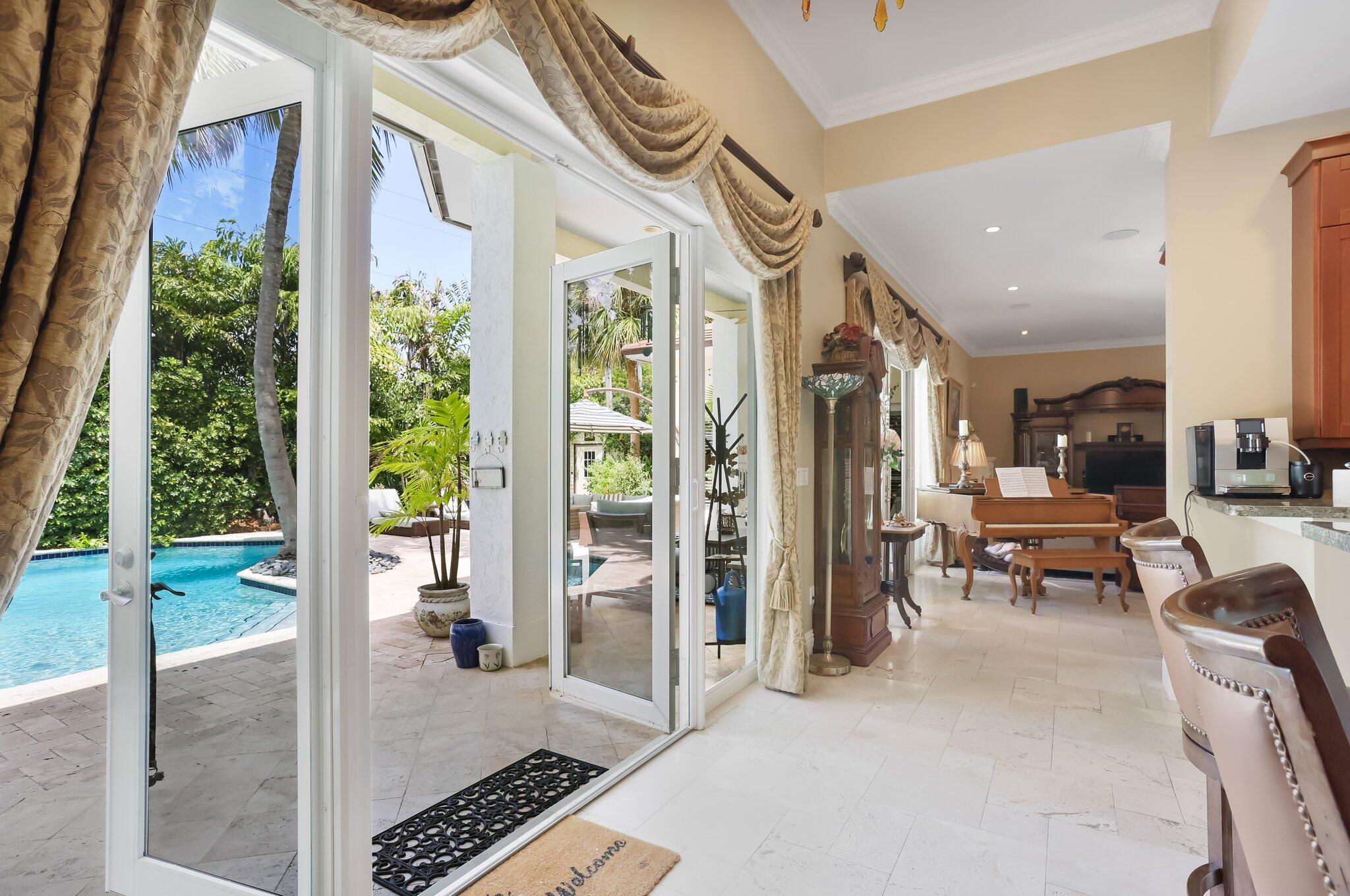 2409 Northeast 12th Street Fort Lauderdale, FL 33304 - Photo 22 of 65 a very nice looking room with a large window and glass door