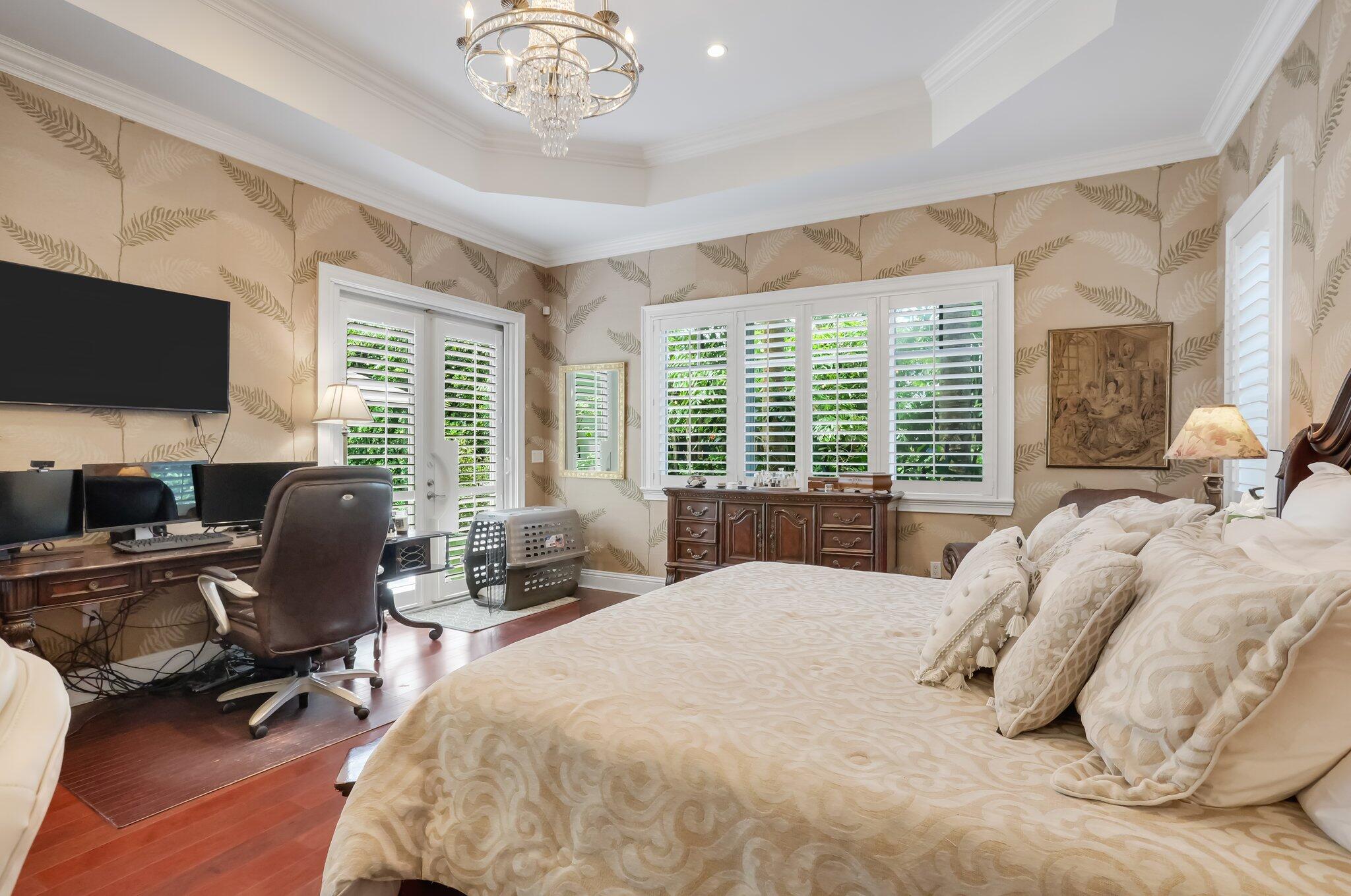 2409 Northeast 12th Street Fort Lauderdale, FL 33304 - Photo 26 of 65 a bedroom with bed tv and window