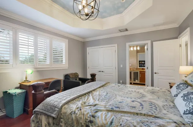 a view of a house with swimming pool and sitting area