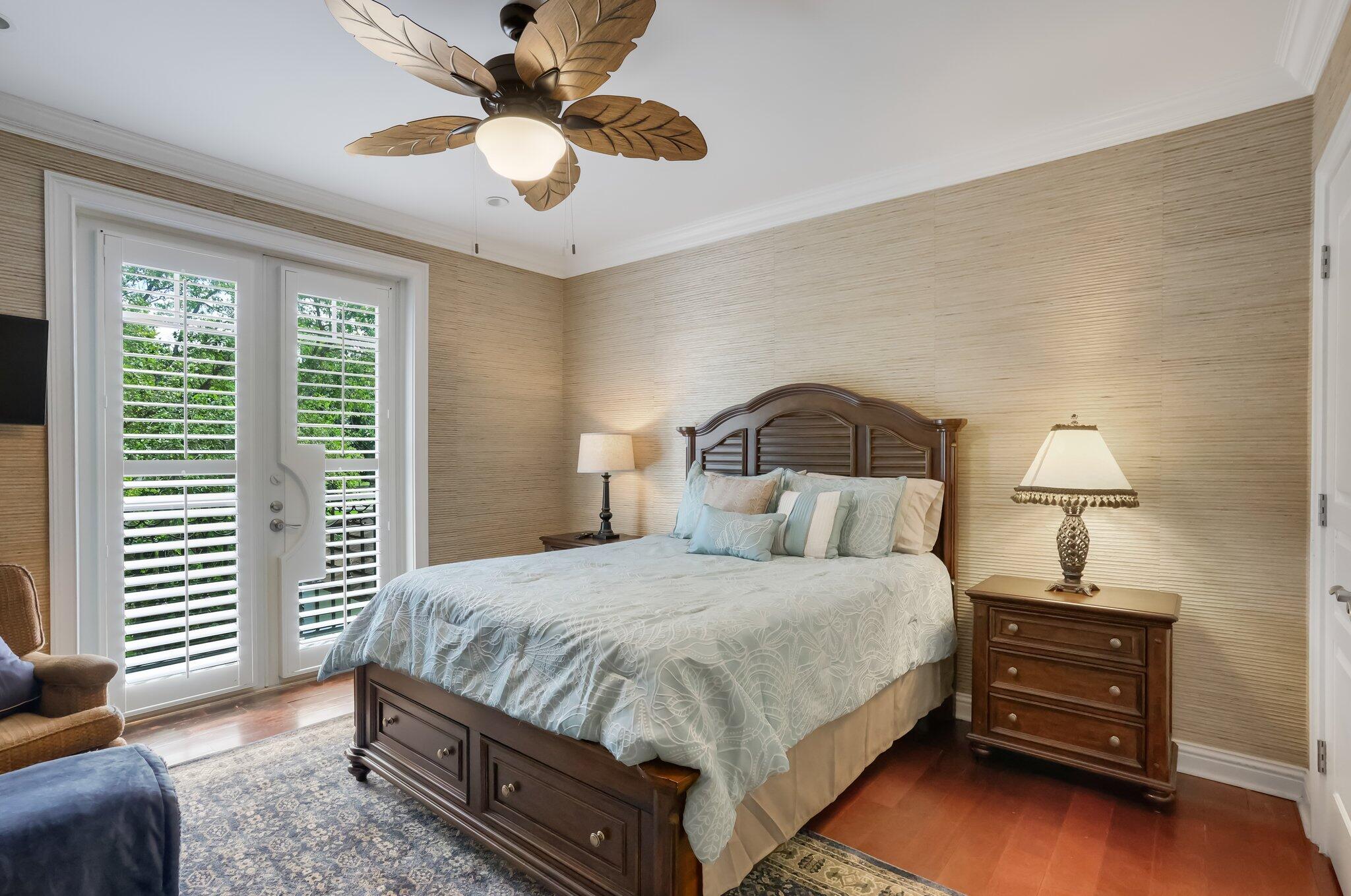 2409 Northeast 12th Street Fort Lauderdale, FL 33304 - Photo 43 of 65 a bedroom with a bed and a ceiling fan