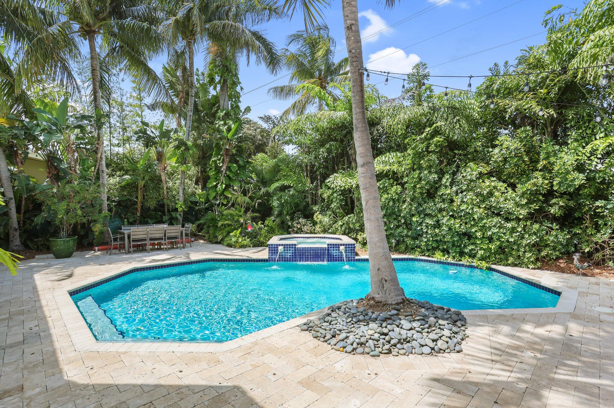 2409 Northeast 12th Street Fort Lauderdale, FL 33304 - Photo 53 of 65 a view of a backyard with a garden and trees