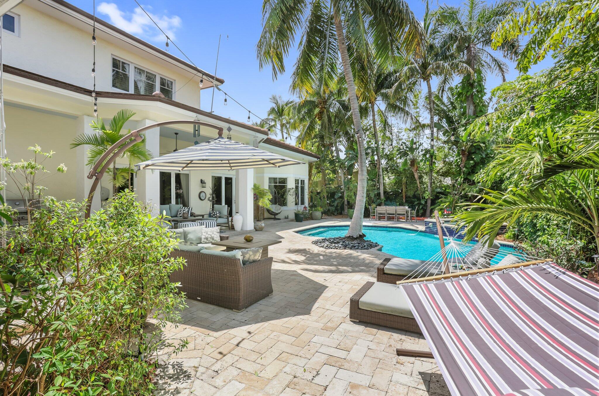 2409 Northeast 12th Street Fort Lauderdale, FL 33304 - Photo 56 of 65 a view of a patio with couches table and chairs and potted plants