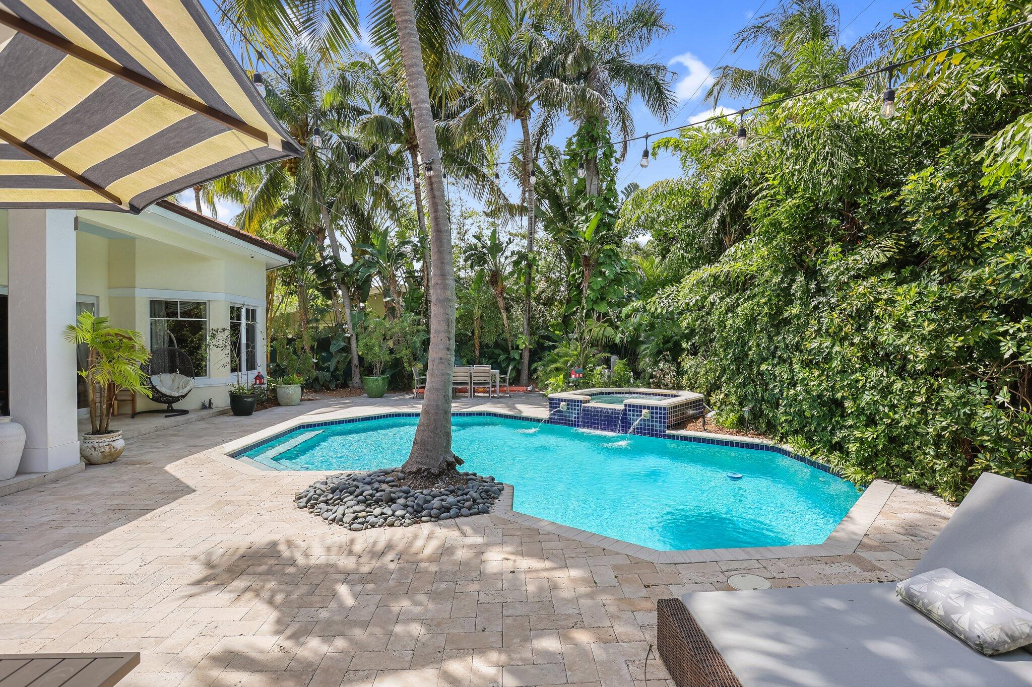 2409 Northeast 12th Street Fort Lauderdale, FL 33304 - Photo 58 of 65 a view of a swimming pool with a patio