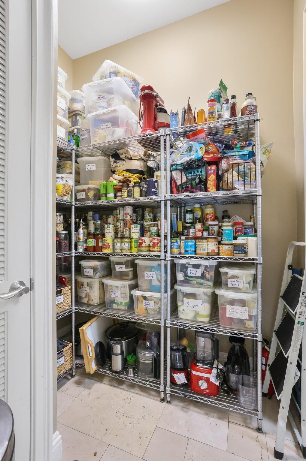 2409 Northeast 12th Street Fort Lauderdale, FL 33304 - Photo 62 of 65 a store room with shelves and a book shelf