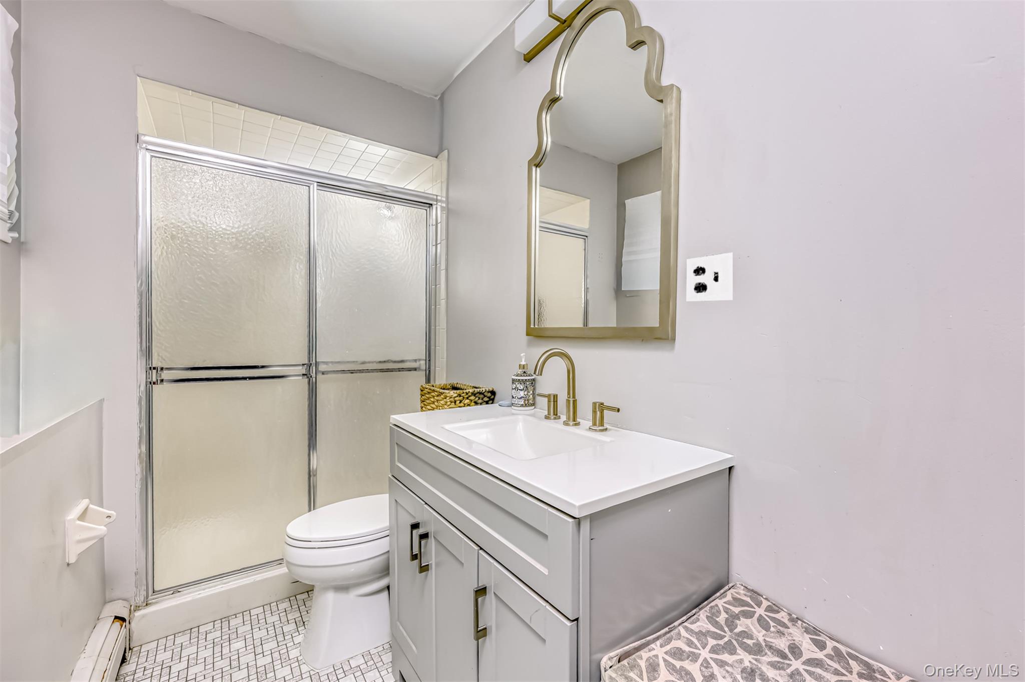 16 Old Pomona Road Suffern, NY 10901 - Photo 17 of 22 a bathroom with a sink a toilet and shower