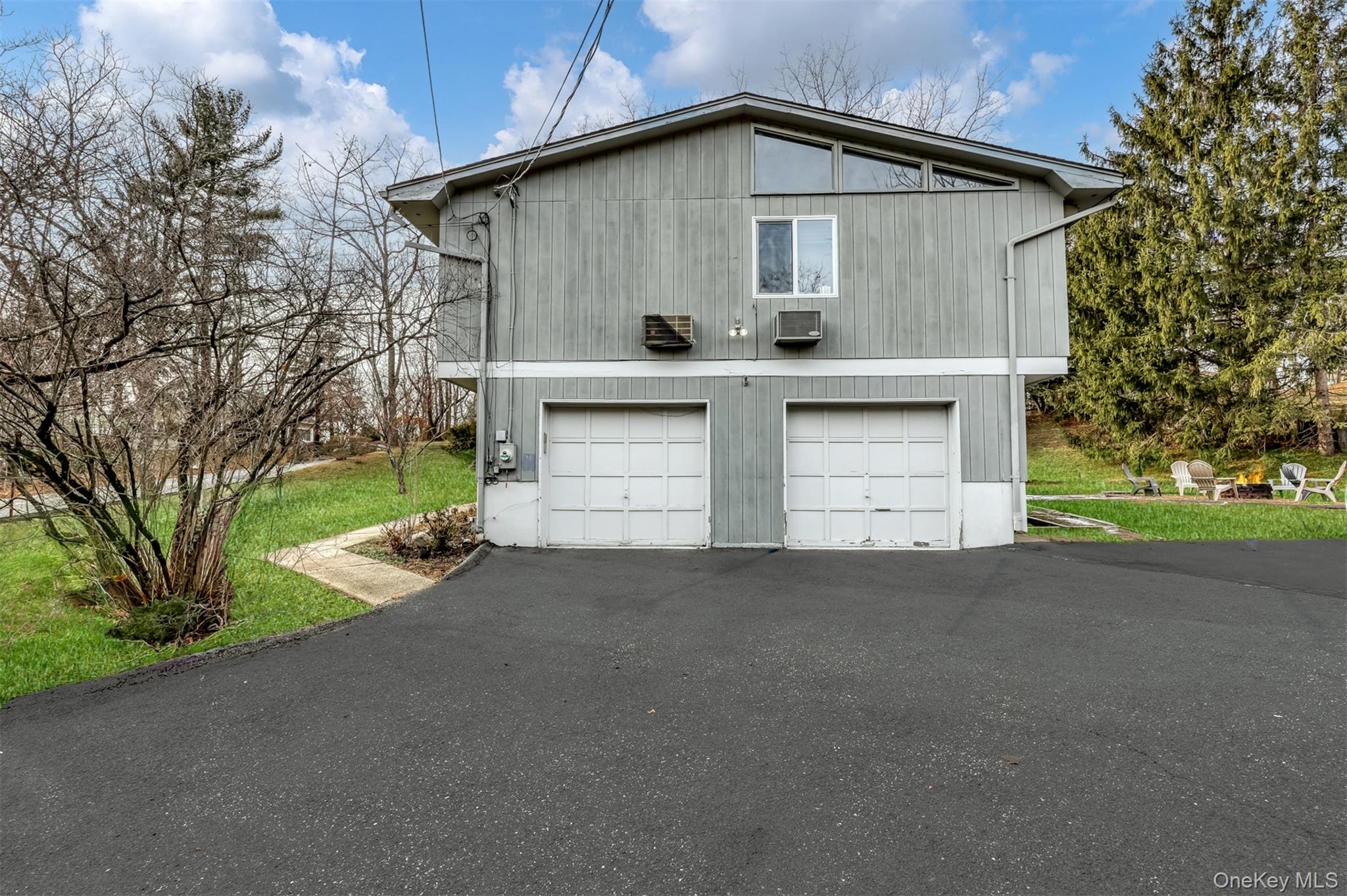 16 Old Pomona Road Suffern, NY 10901 - Photo 19 of 22 a view of a house with a yard and garage