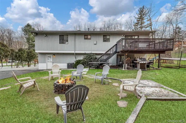 a view of an house with backyard porch and sitting area