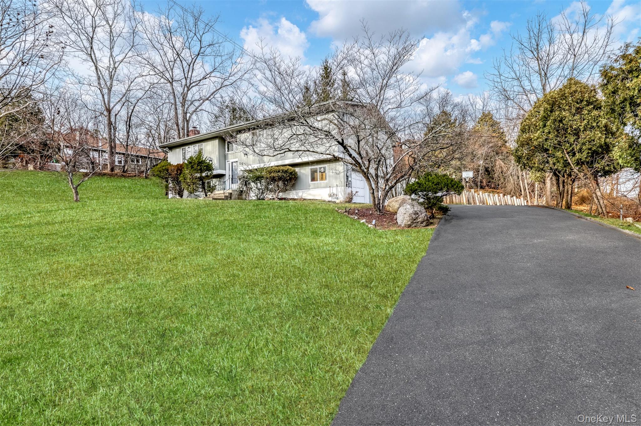 16 Old Pomona Road Suffern, NY 10901 - Photo 2 of 22 a front view of a house with garden