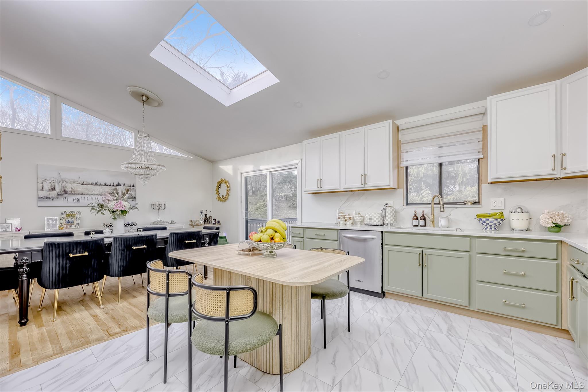 16 Old Pomona Road Suffern, NY 10901 - Photo 7 of 22 a kitchen with a dining table cabinets and wooden floor