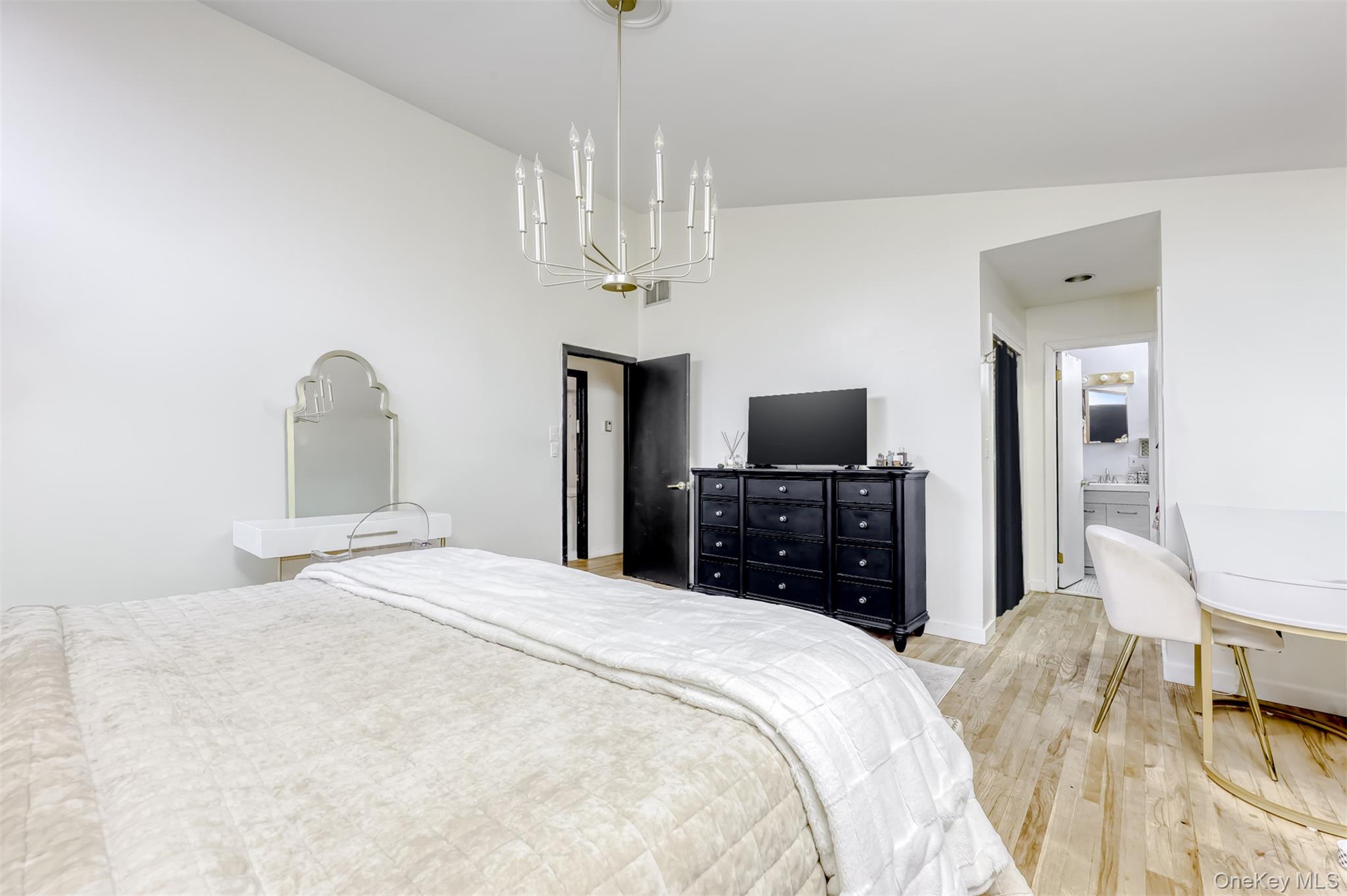 16 Old Pomona Road Suffern, NY 10901 - Photo 9 of 22 a bedroom with a bed and a flat screen tv