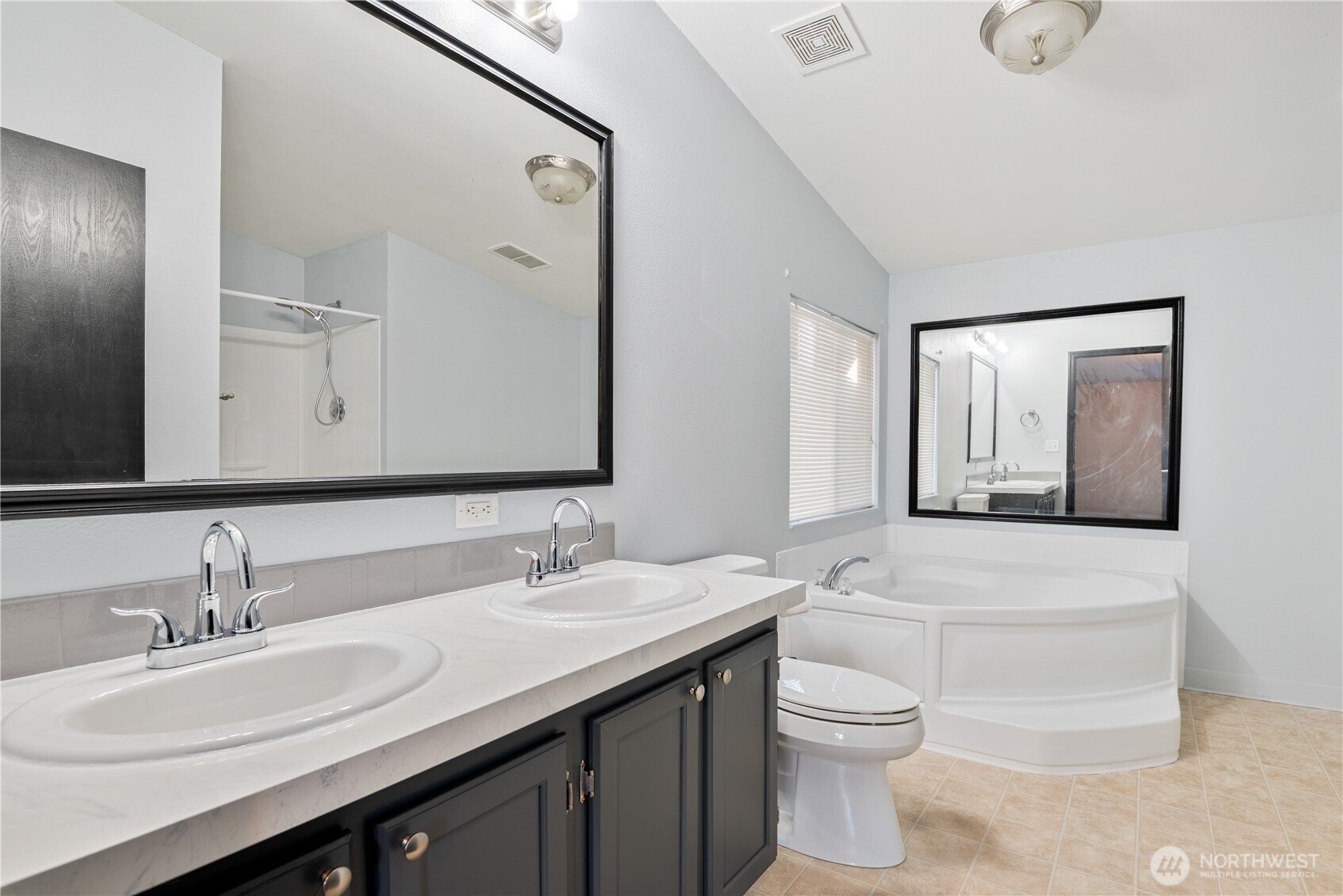 233 Concord Place Longview, WA 98632 - Photo 13 of 34 a bathroom with a double vanity sink and a mirror