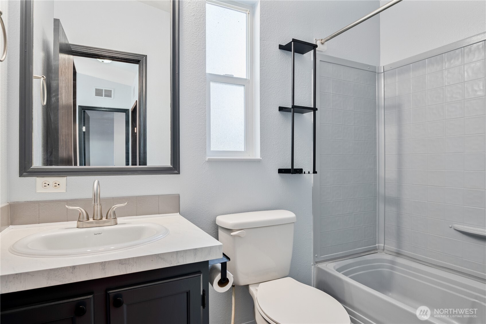 233 Concord Place Longview, WA 98632 - Photo 17 of 34 a bathroom with a sink toilet vanity and shower