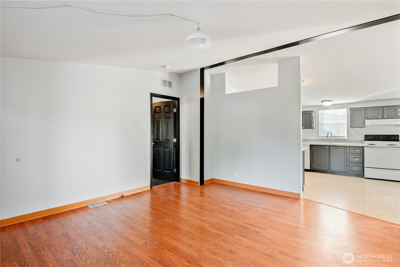 233 Concord Place Longview, WA 98632 - Photo 5 of 34 a view of a kitchen with wooden floor and a kitchen