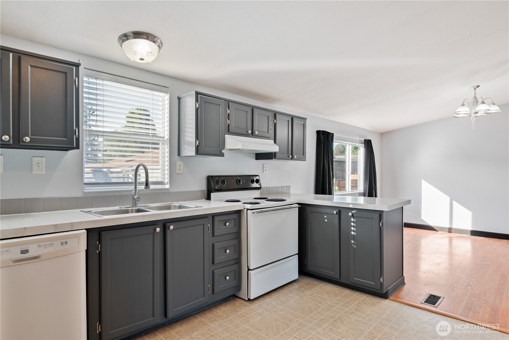 233 Concord Place Longview, WA 98632 - Photo 9 of 34 a kitchen with a sink cabinets and window