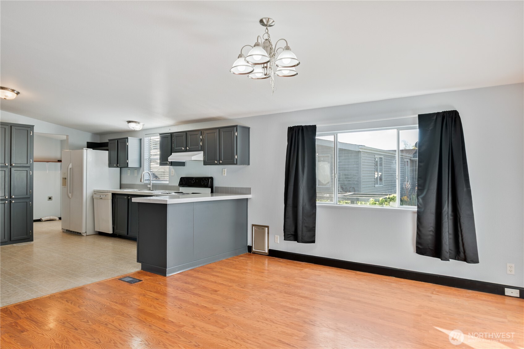 233 Concord Place Longview, WA 98632 - Photo 10 of 34 a kitchen with stainless steel appliances a refrigerator sink and stove
