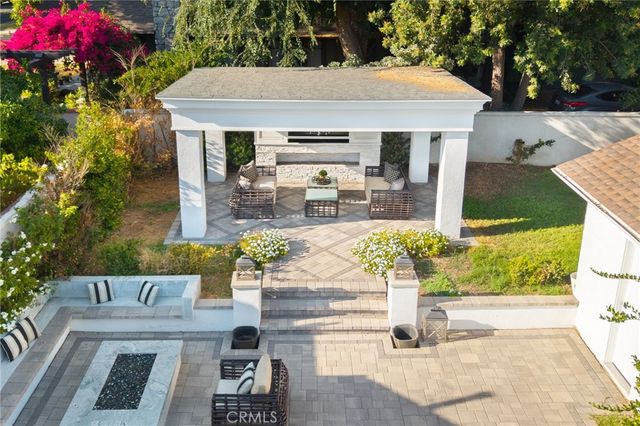 a view of house with swimming pool outdoor seating