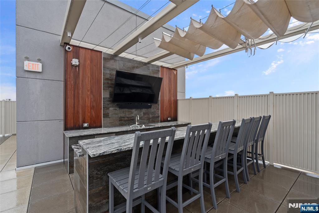 620 Bloomfield Avenue, Unit PHB Bloomfield, NJ 07003 - Photo 14 of 36 a view of a chairs and table in the patio