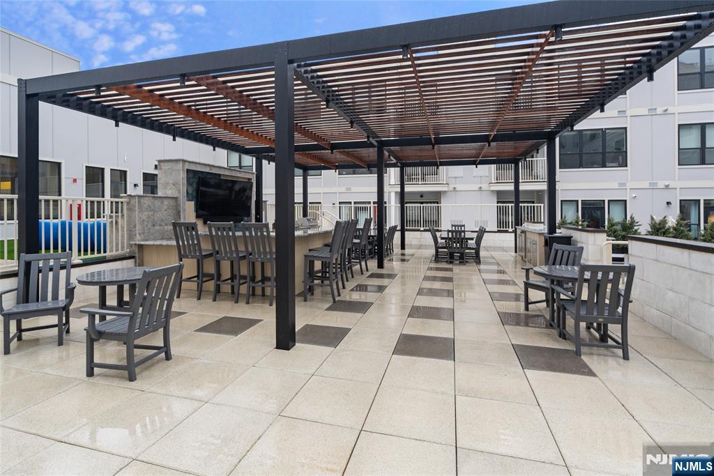 620 Bloomfield Avenue, Unit PHB Bloomfield, NJ 07003 - Photo 17 of 36 a view of a patio with table and chairs