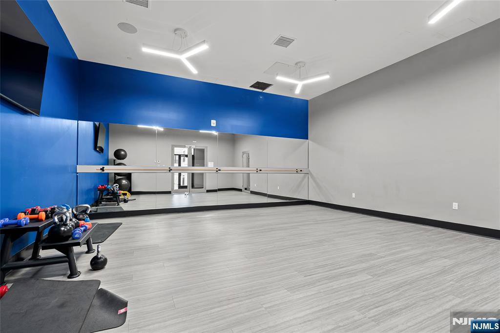 620 Bloomfield Avenue, Unit PHB Bloomfield, NJ 07003 - Photo 18 of 36 a view of a room with gym equipment