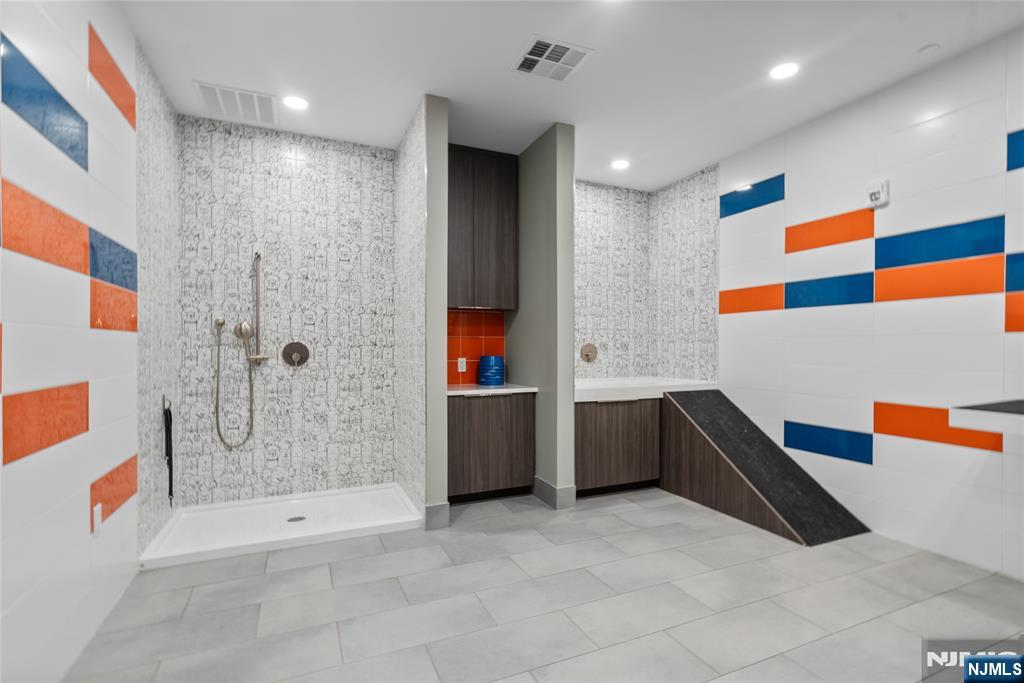 620 Bloomfield Avenue, Unit PHB Bloomfield, NJ 07003 - Photo 28 of 36 a bathroom with a bathtub and a shower