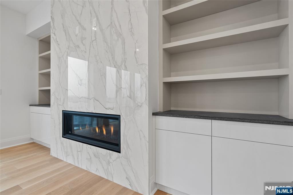 620 Bloomfield Avenue, Unit PHB Bloomfield, NJ 07003 - Photo 4 of 36 a living room with a fireplace