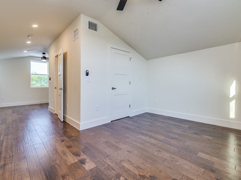 6412 Carson Ridge, Unit B Austin, TX 78741 - Photo 17 of 29 a view of a livingroom with wooden floor