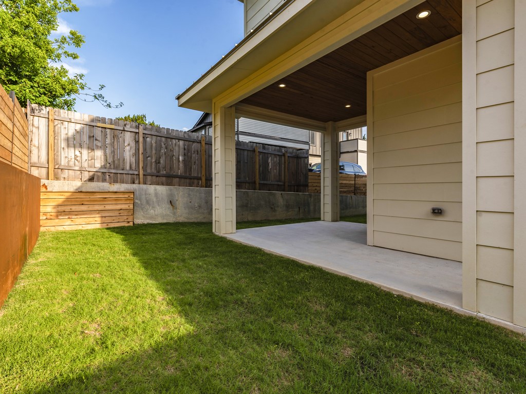 6412 Carson Ridge, Unit B Austin, TX 78741 - Photo 22 of 29 a view of a backyard with a garden