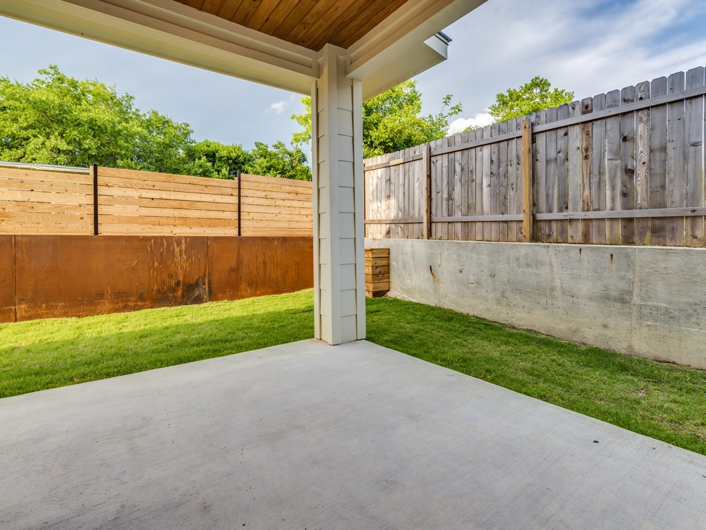 6412 Carson Ridge, Unit B Austin, TX 78741 - Photo 26 of 29 a view of a backyard with wooden fence