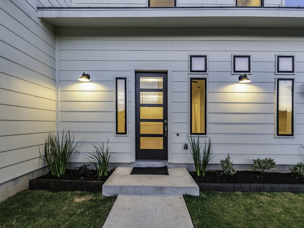 6412 Carson Ridge, Unit B Austin, TX 78741 - Photo 29 of 29 a front view of a house with garden