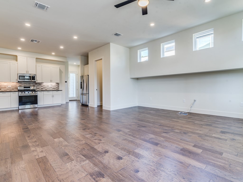 6412 Carson Ridge, Unit B Austin, TX 78741 - Photo 4 of 29 a view of a kitchen with a sink and a stove top oven