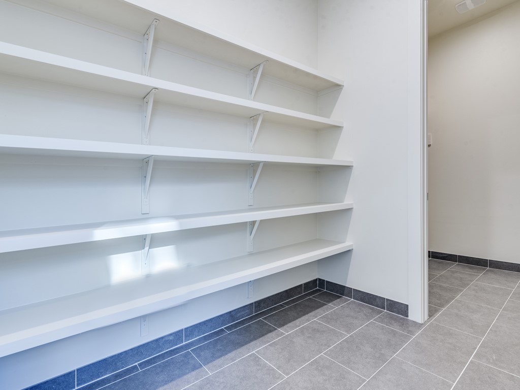 6412 Carson Ridge, Unit B Austin, TX 78741 - Photo 6 of 29 a view of walk in closet with empty racks