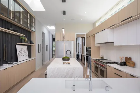 a bathroom with a toilet a sink and shower