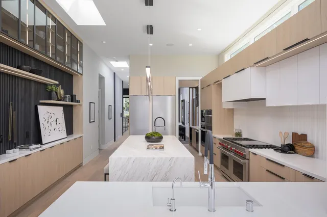 a bathroom with a toilet a sink and shower