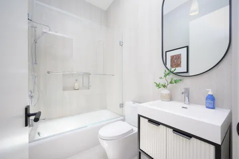 a kitchen with a refrigerator stove and cabinets