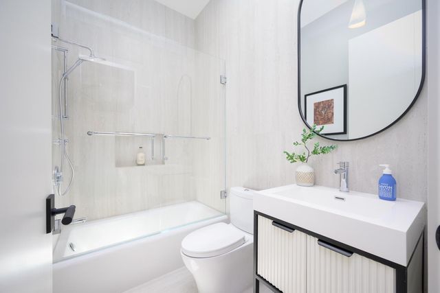 a kitchen with a refrigerator stove and cabinets