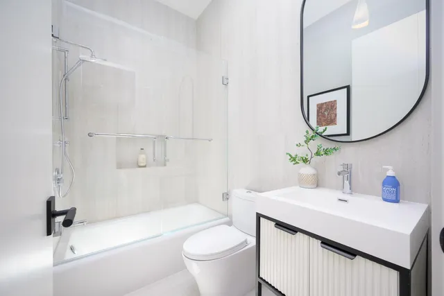 a kitchen with a refrigerator stove and cabinets