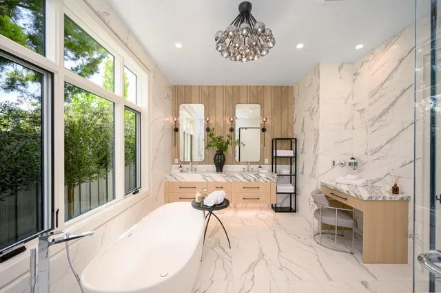 a kitchen with stainless steel appliances kitchen island granite countertop a sink and cabinets
