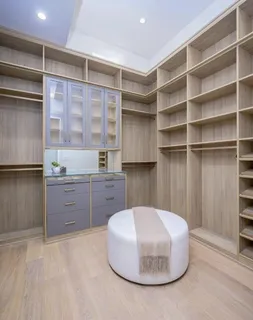 a kitchen with a table and chairs in it