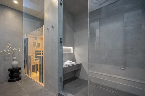 a bathroom with a toilet a sink and a mirror