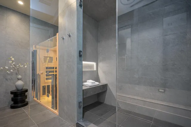 a bathroom with a toilet a sink and a mirror