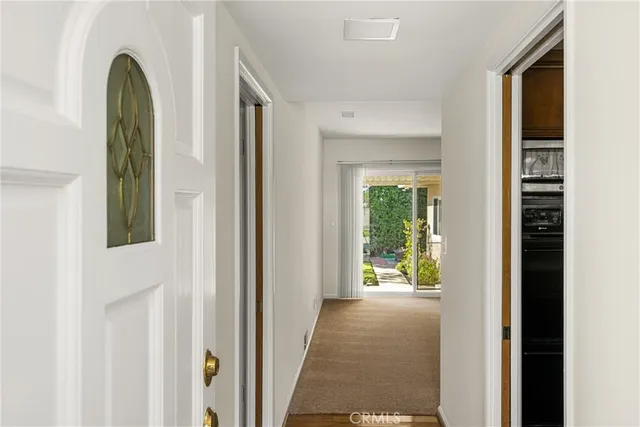 a view of a hallway with windows