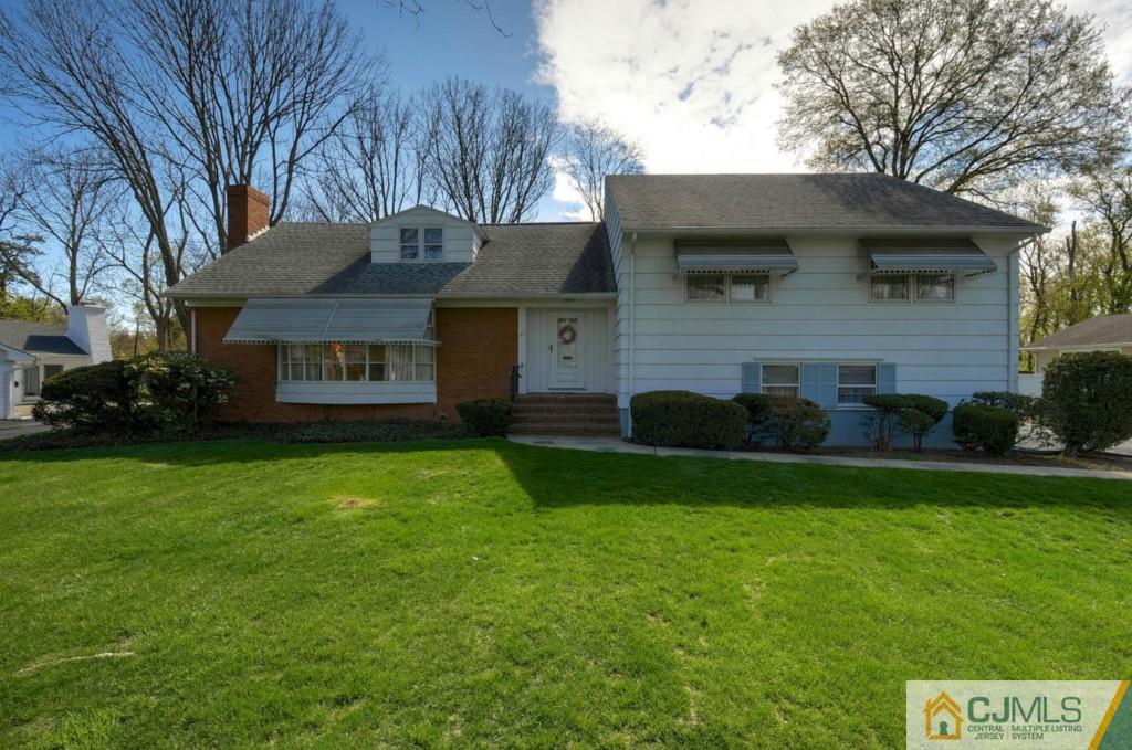 11 Stafford Road Colonia, NJ 07067 - Photo 1 of 25 a front view of house with yard and green space
