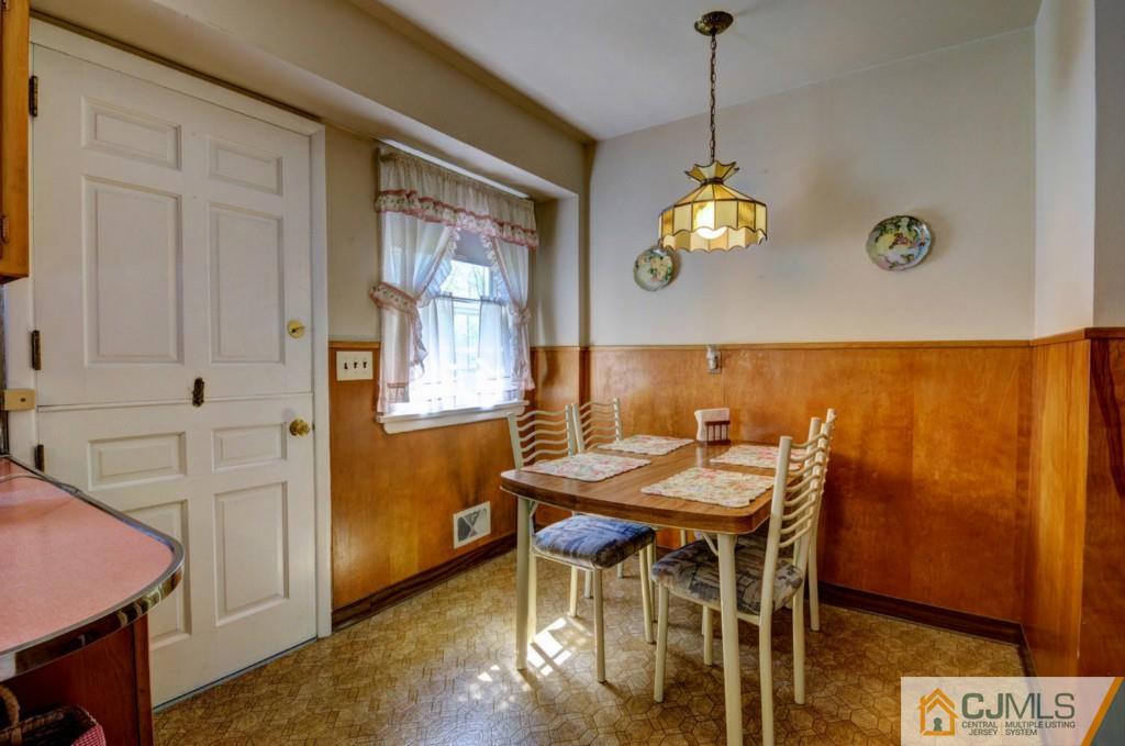 11 Stafford Road Colonia, NJ 07067 - Photo 11 of 25 a dining room with furniture and window