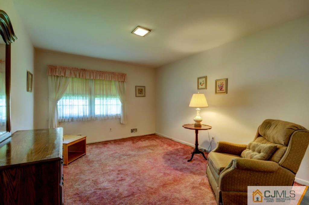 11 Stafford Road Colonia, NJ 07067 - Photo 14 of 25 a living room with furniture and a window