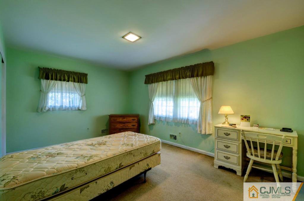 11 Stafford Road Colonia, NJ 07067 - Photo 15 of 25 a bedroom with a bed and a window