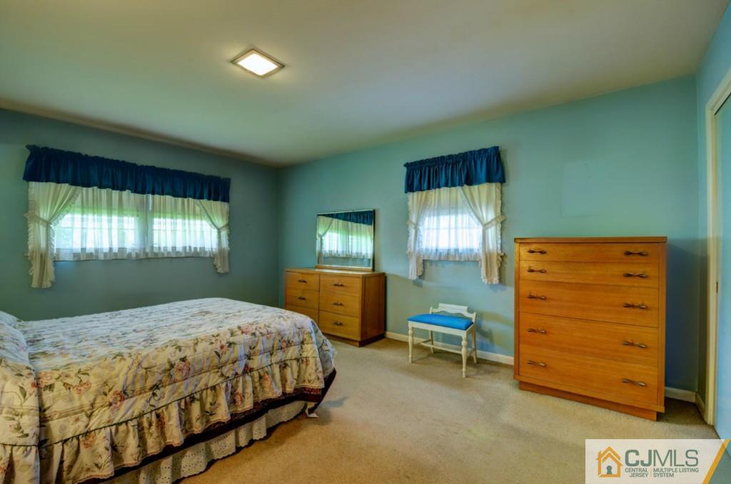 11 Stafford Road Colonia, NJ 07067 - Photo 16 of 25 a bedroom with a bed and a dresser