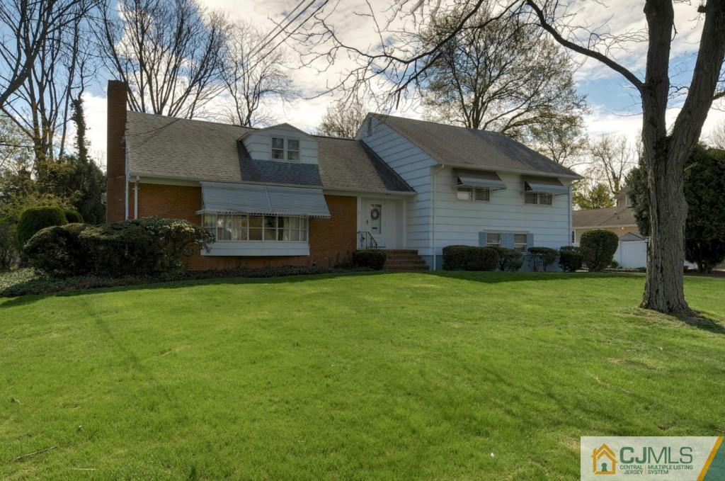 11 Stafford Road Colonia, NJ 07067 - Photo 3 of 25 a view of a house with a big yard and large trees
