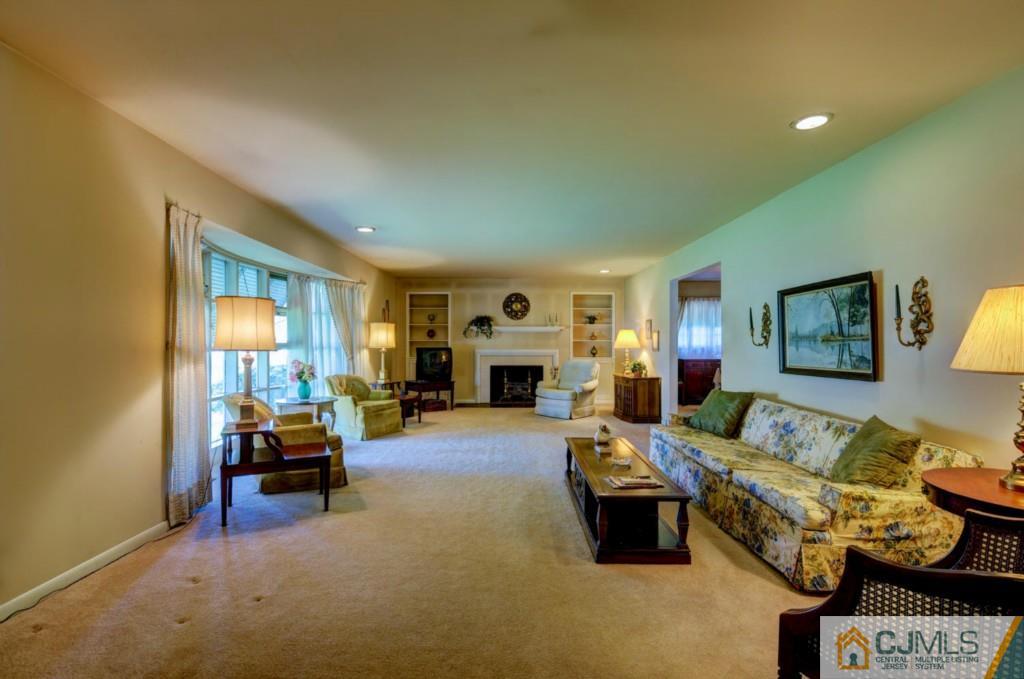 11 Stafford Road Colonia, NJ 07067 - Photo 4 of 25 a living room with furniture and a fireplace