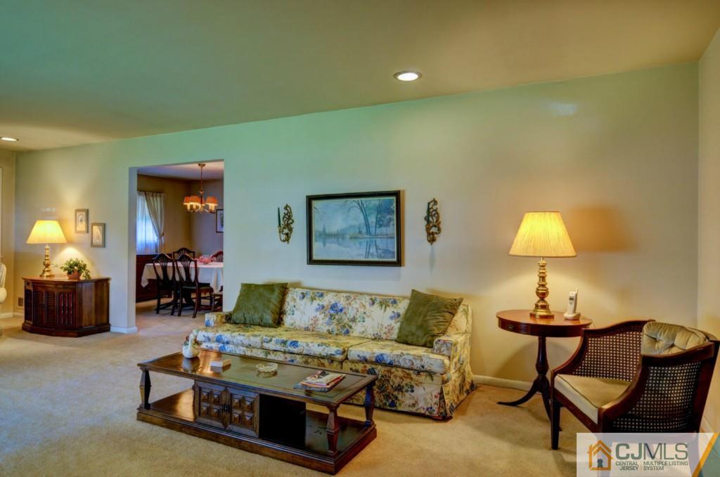11 Stafford Road Colonia, NJ 07067 - Photo 5 of 25 a living room with furniture and a lamp