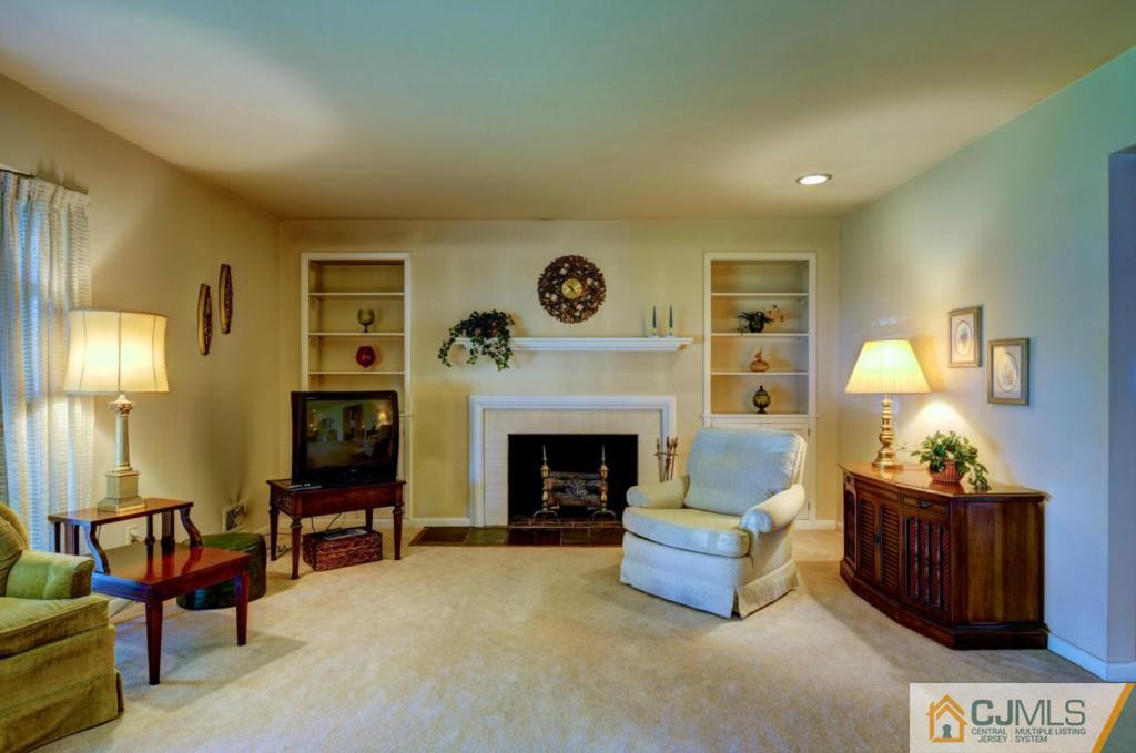 11 Stafford Road Colonia, NJ 07067 - Photo 6 of 25 a living room with furniture and a fireplace